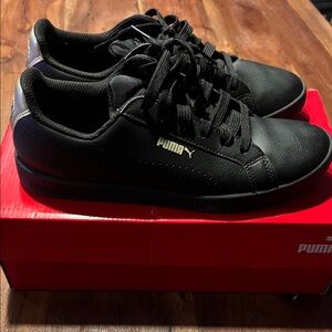 Puma Women’s Black and Gold Sneakers